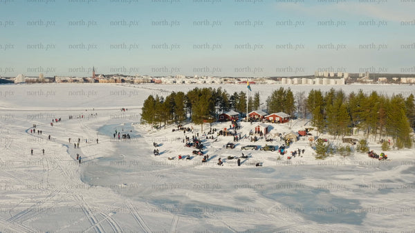 Winter wonderland in Luleå: Aerial view of frozen lake activities and scenic landscape
