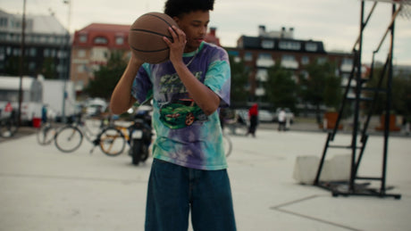 Young Men Playing One-On-One Basketball on an Urban Court in Lulea, Sweden