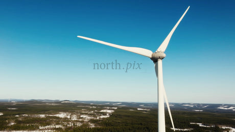 Close Up of Wind Turbine in Snowy Markbygden, Winter, Blue Sky, Aerial View