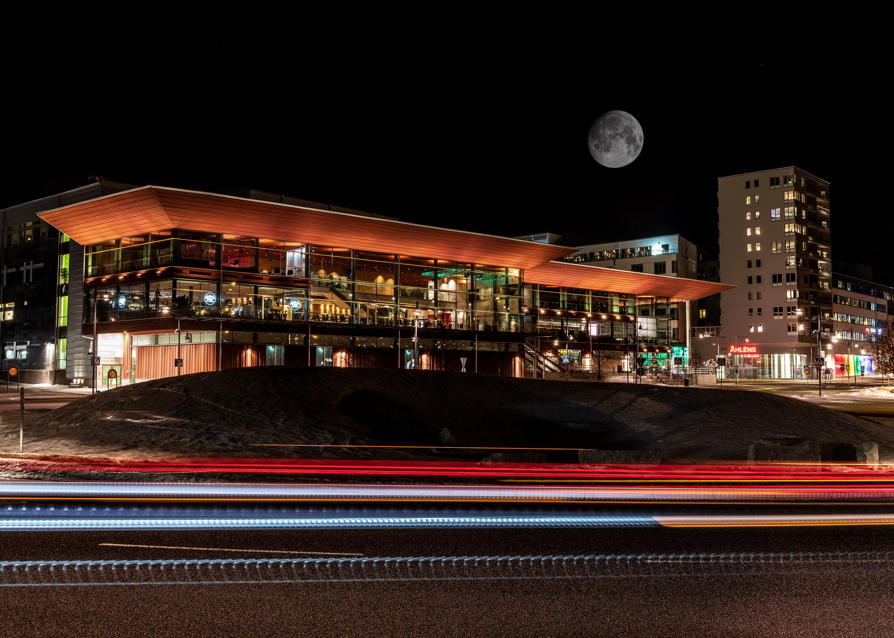 Kulturens hus with moon and light trails at night