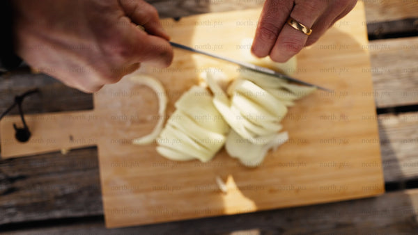 Chopping onions outdoors in winter