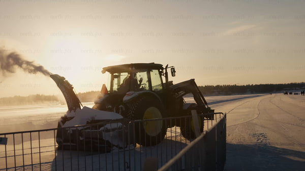 Speed skater training on a frozen lake in Luleå at sunset during winter