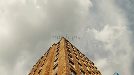 Modern Wood Architecture: A Low Angle Tilt-Up View Against a Cloudy Sky