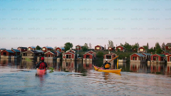 Kayaking in the Luleå archipelago on a bright summer evening