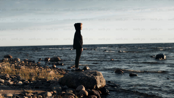 Summer evening in Luleå: Person contemplates the Baltic Sea at twilight