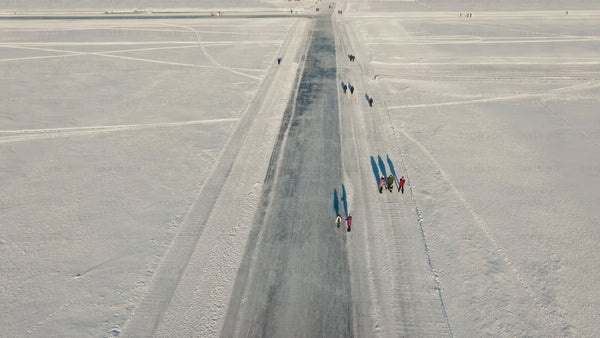 Aerial view of ice road on frozen lake near Luleå in winter