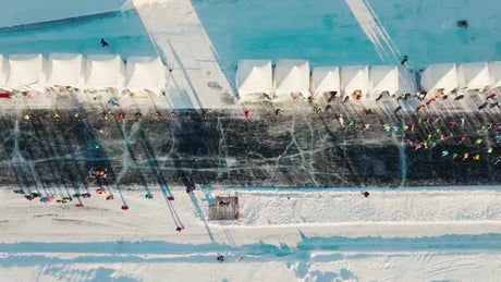 Snowmobile Gathering on Frozen Track in Luleå, Sweden - Winter Drone Shot