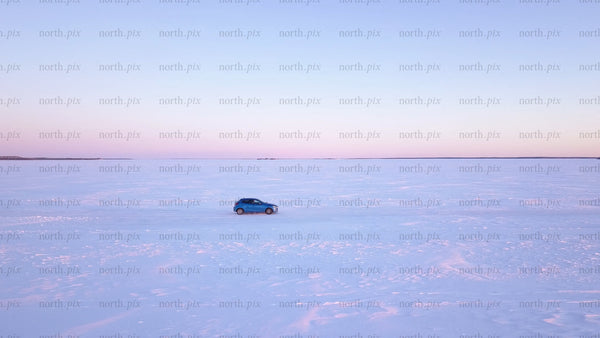 Winter sunset drive on a frozen ice road in the Luleå archipelago