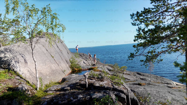 Summer exploration in Luleå archipelago: Group on rocky coast