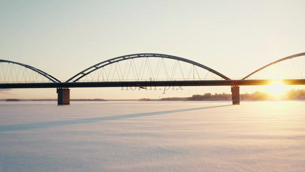 Winter Sunset Over Bridge in Lulea, Sweden: Aerial Drone Footage