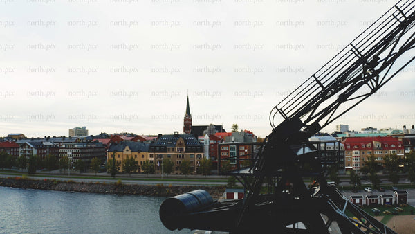 Luleå cityscape in autumn with a crane in the foreground