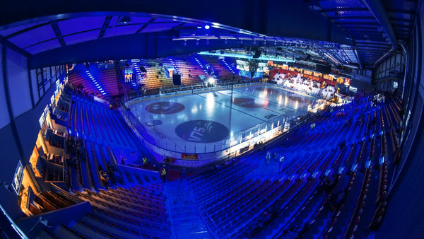 Timelapse of a hockey game in a packed arena with cheering fans