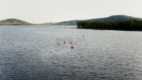 Kayakers on a Summer Day in Luleå, Sweden: A Tranquil Lake Adventure