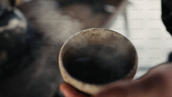 Steaming cup of coffee on a winter day in Luleå