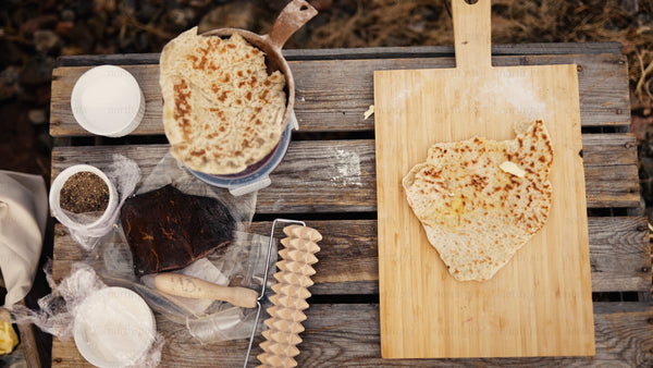 Freshly baked flatbread with butter: Outdoor cooking in Luleå
