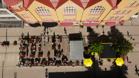 Summer in Lulea, Sweden: Aerial View of City Street, Outdoor Restaurant, and Pedestrians