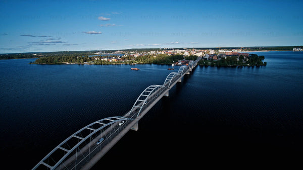 Aerial view of Bergnäsbron bridge and Luleå cityscape on a sunny summer day
