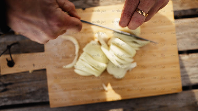 Chopping onions outdoors in winter