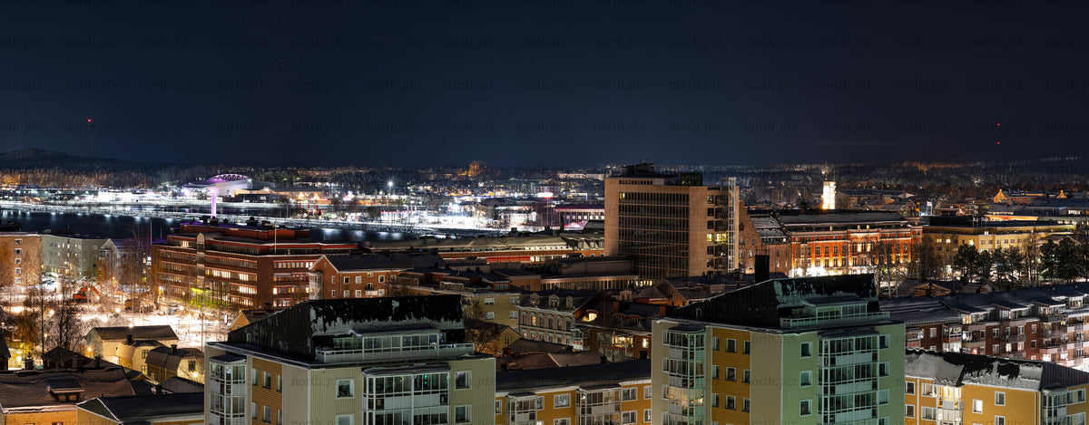 City skyline at night from elevated viewpoint