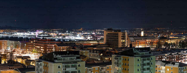 City skyline at night from elevated viewpoint