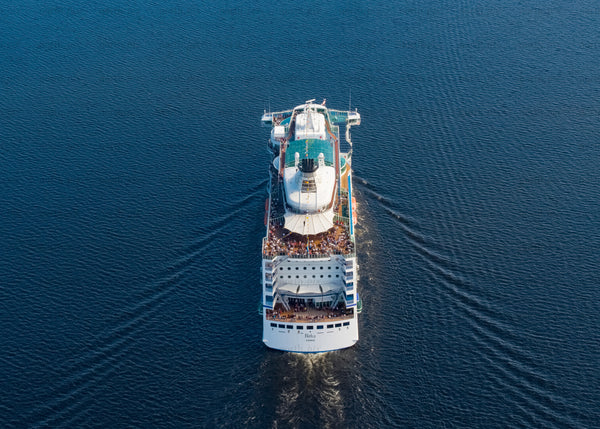 Aerial view of cruise ship sailing in summer evening