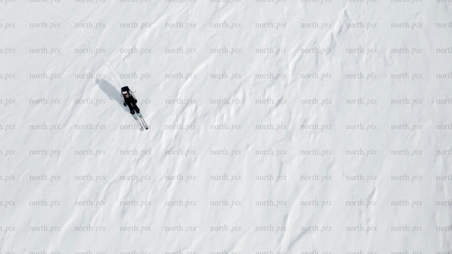 Skier on a snowy slope: Winter sports adventure