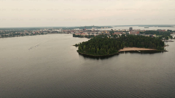 Aerial view of Luleå: Motorboats on a calm summer evening