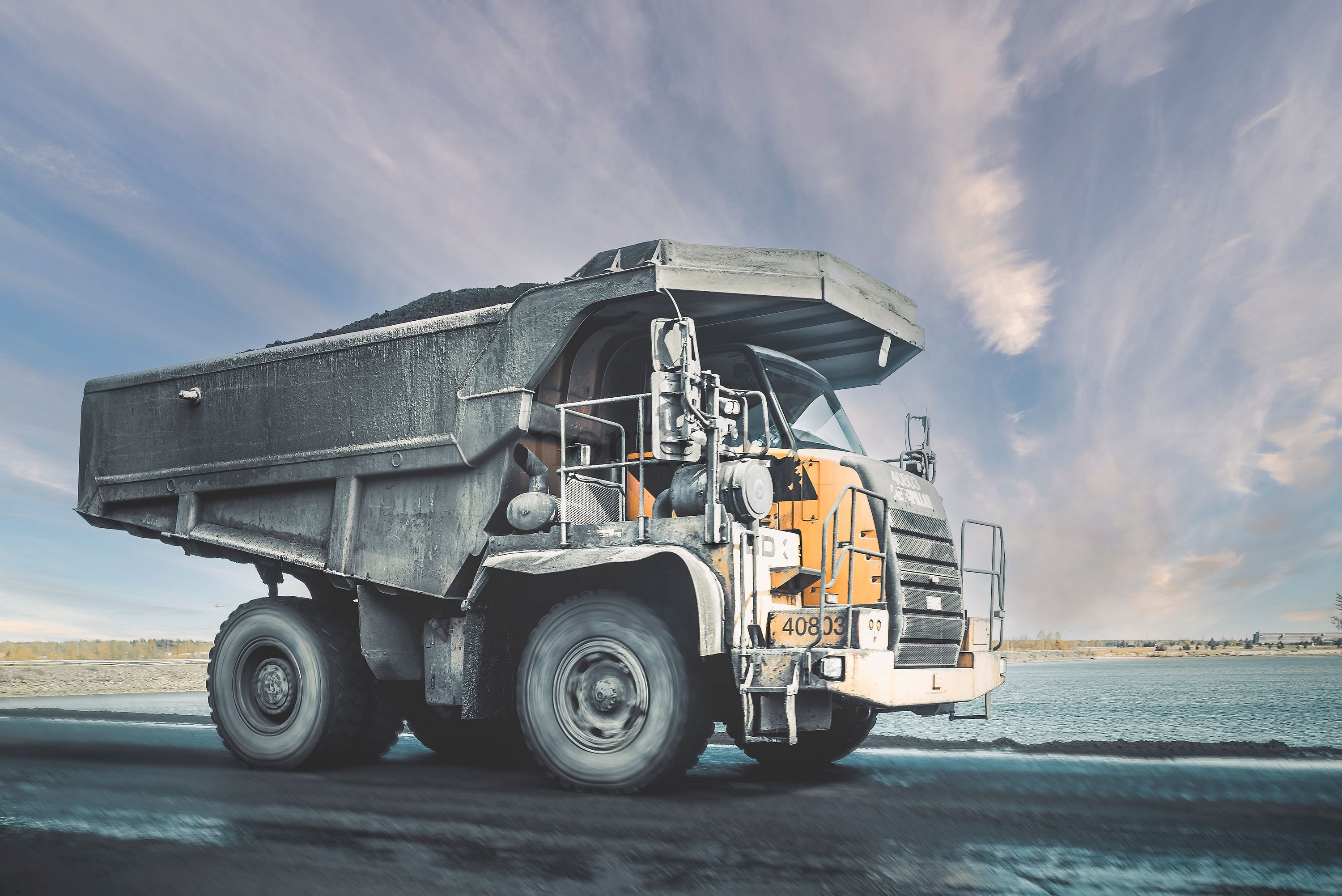 Large mining dump truck on road in daytime