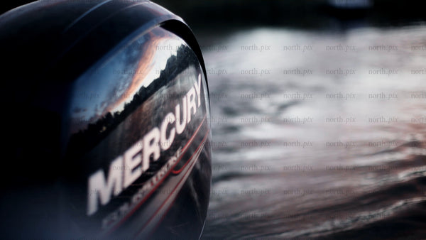 Summer evening boat trip: Close-up of mercury outboard motor in Luleå archipelago