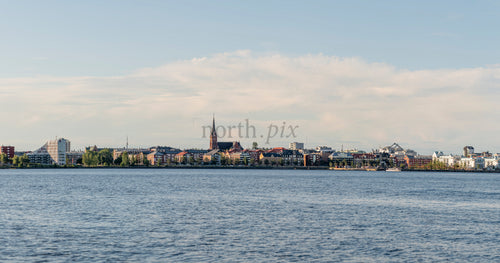 Panoramic waterfront city skyline in summer afternoon