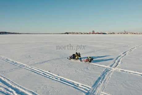 Snowy Day Sledding On Frozen Lake Near Luleå City Center With Family And Friends