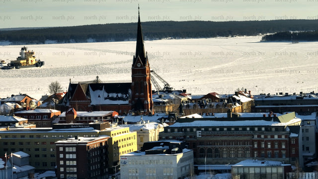 Winter day in Luleå: Aerial view of frozen river and cathedral