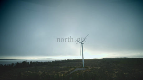 Rotating Wind Turbine by the Sea: Aerial View of Sustainable Energy in Finland