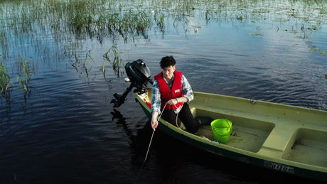 Summer Crayfish Fishing in Luleå, Sweden: Pulling Up a Trap From a Boat
