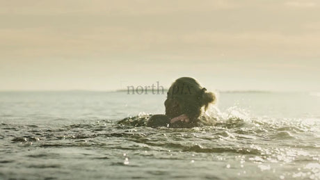Woman Swimming in the Baltic Sea, Luleå Archipelago, Sweden, Summer