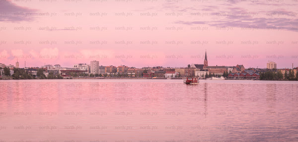 Panorama of waterfront town at sunset