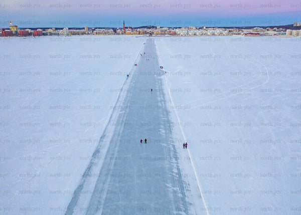 Drone view of winter ice path in Luleå during blue hour