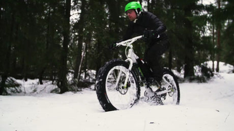 Fatbike Riding in Snowy Forest Trail in Luleå, Sweden, Winter Day