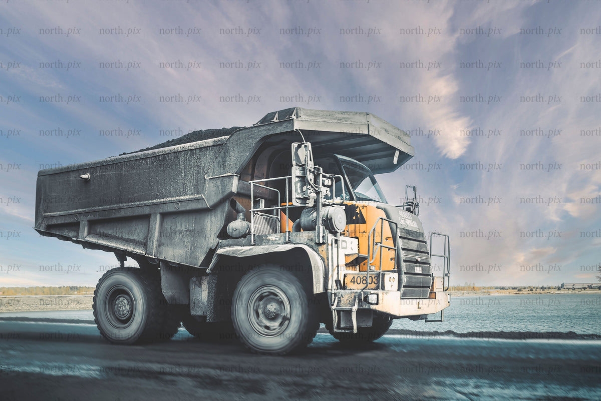 Large mining dump truck on road in daytime