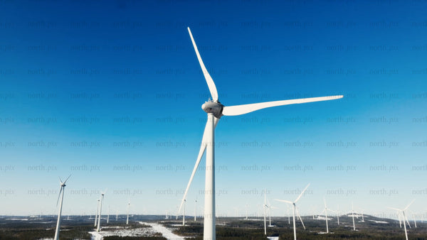 Wind turbines generating clean energy in a winter landscape