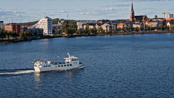 Boat trip in Luleå: Aerial view of city skyline, summer day