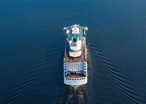 Aerial view of cruise ship sailing in summer evening