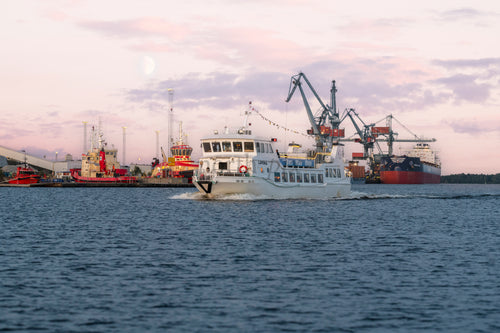 Passenger ferry in harbor at dusk