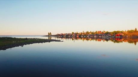 Golden Hour Drone Shot: Red Cabins of the Luleå Archipelago, Sweden