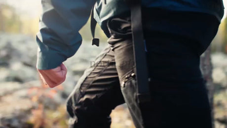 Autumn Hike in Luleå, Sweden: Hiker Exploring Rocky Terrain in Bright Sunlight