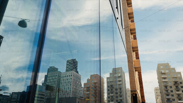 Modern wood architecture in the city: Glass reflection and dynamic camera movement