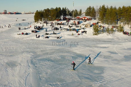 Winter Fun At Luleå City Center: Skaters And Snowy Gatherings On A Frozen Lake