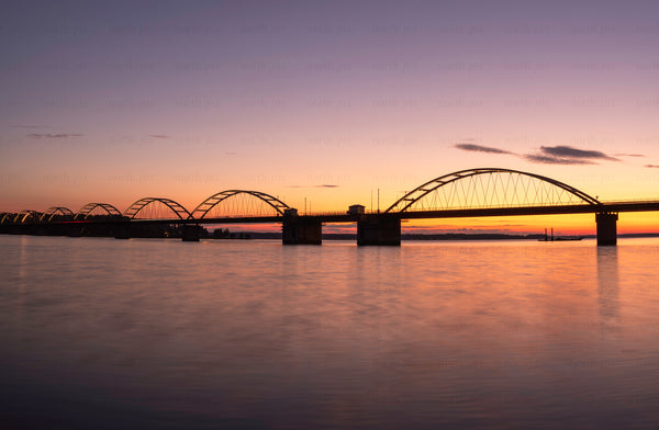 Bergnäsbron arched bridge at sunset over river