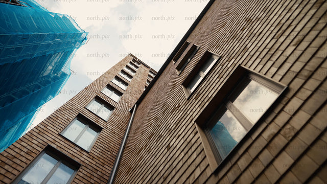 Modern wood architecture: High-rise building facade and windows with scaffolding
