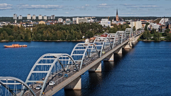 Aerial view of Luleå city skyline with Bergnäsbron bridge on a sunny summer day